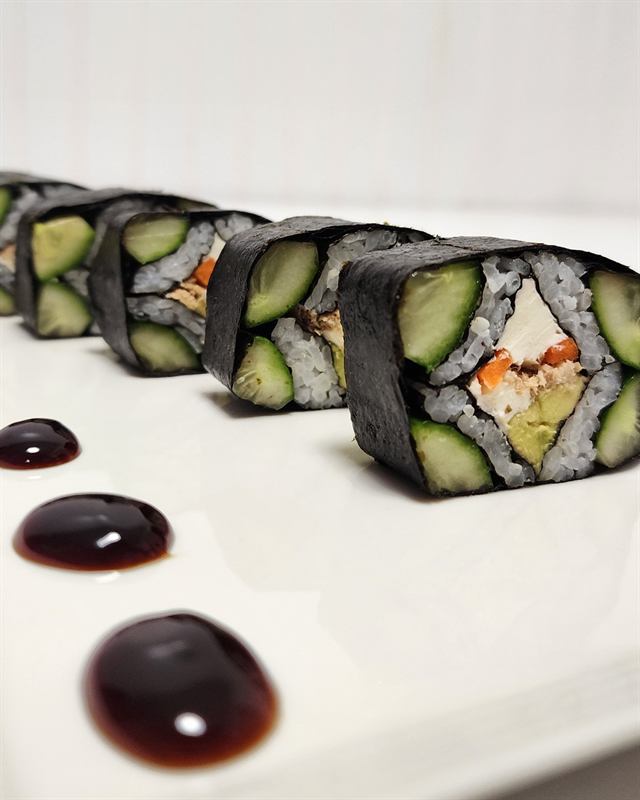Close-up of cucumber-wrapped sushi rolls