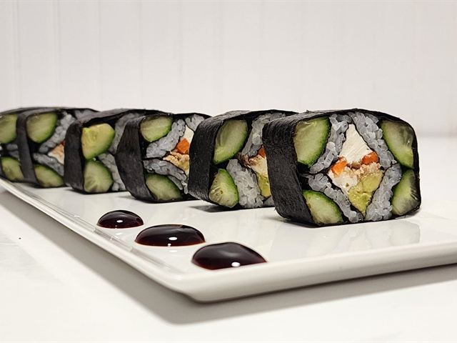 Prepared sushi rolls plated